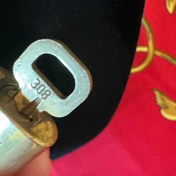 Authentic Louis Vuitton lock and key #308
with unbranded chain and earrings. - Picture 5 of 5